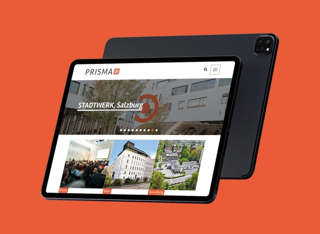 Ein Tablet, das die Startseite der neuen Prisma-Website anzeigt